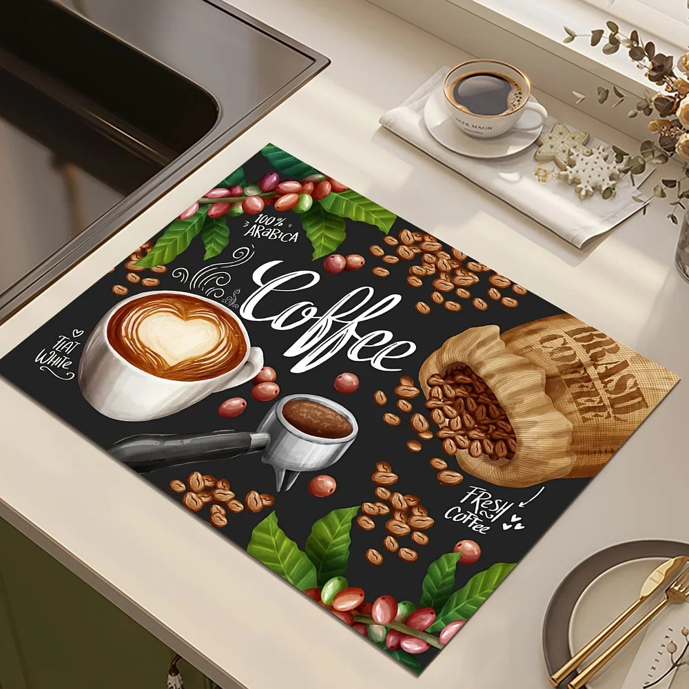 Tapis-de-séchage-coffee-entre-un-coin-d'évier-noir-et une-assiette-avec-petit-couteau-et-fourchette-doré-et-au-coin-haut-droit-une-tase-de-café-pleine-avec-deux-biscuits-en-forme-de-flocon-de-neige-sur-le-tapis-il-y a-le-dessin-d'une-tasse-à-café-avec-crème-en-forme-de-coeur